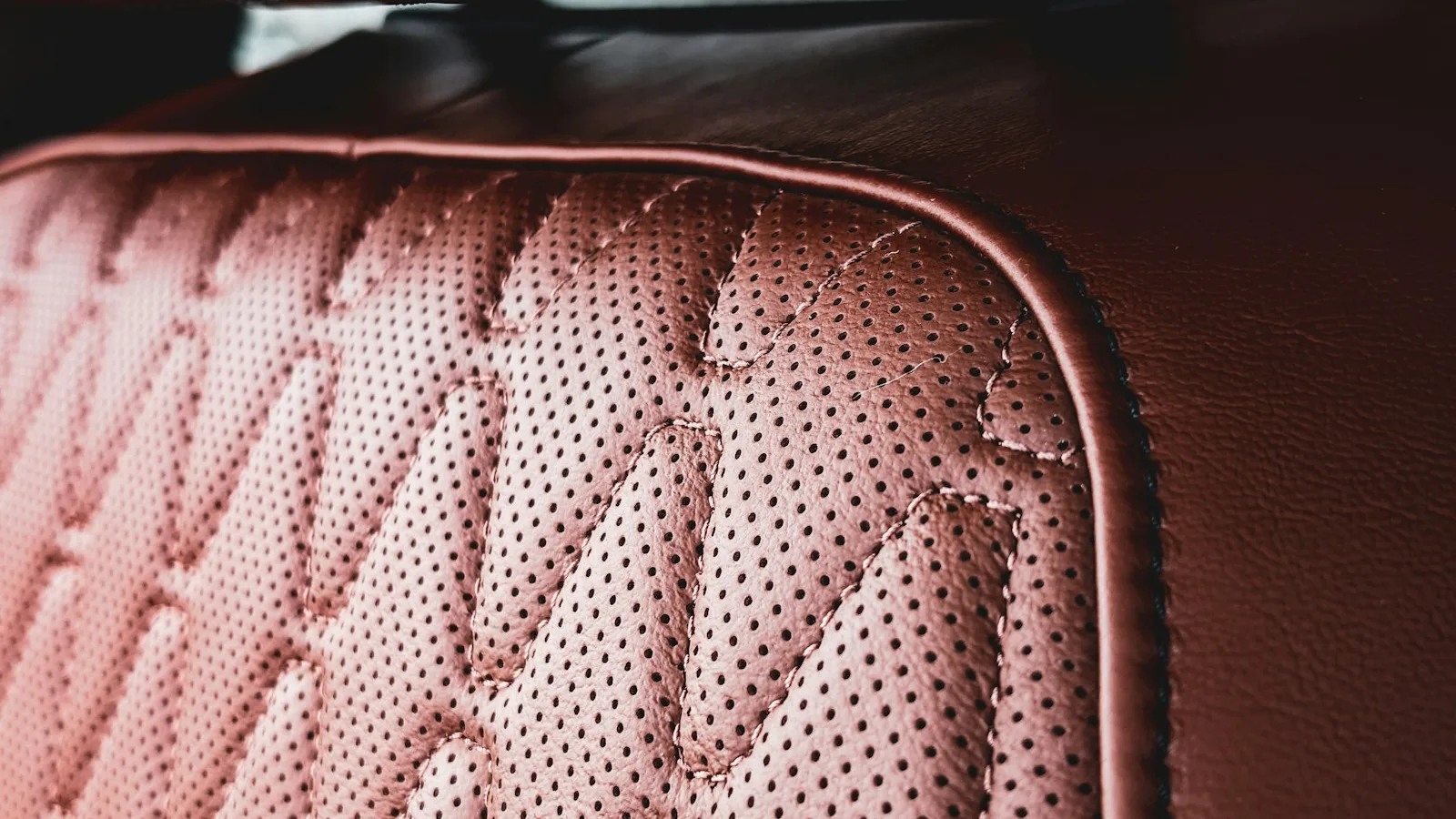 Close-up of quilted and stitched leather upholstery